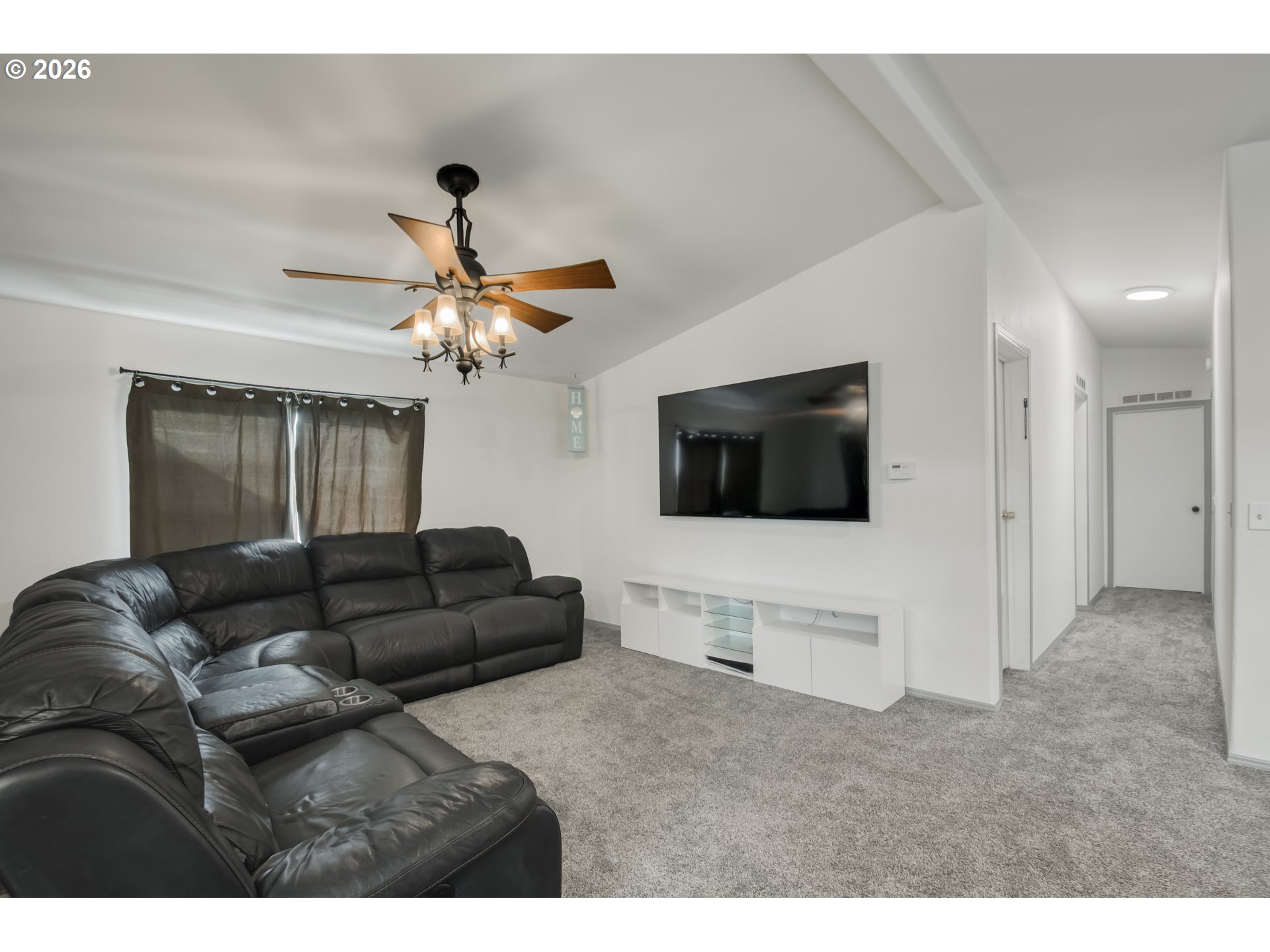 513 Rose Avenue Vernonia, OR 97064 - Photo 4 of 19 a living room with furniture and a flat screen tv