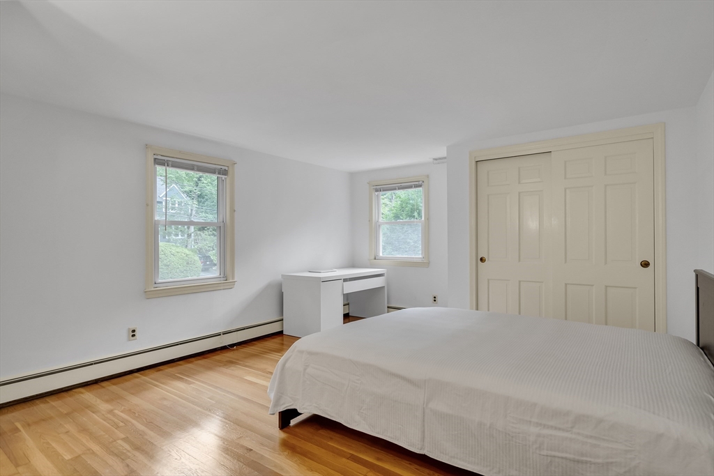 32 Dewey Road Lexington, MA 02420 - Photo 22 of 32 a bedroom with a bed and a window
