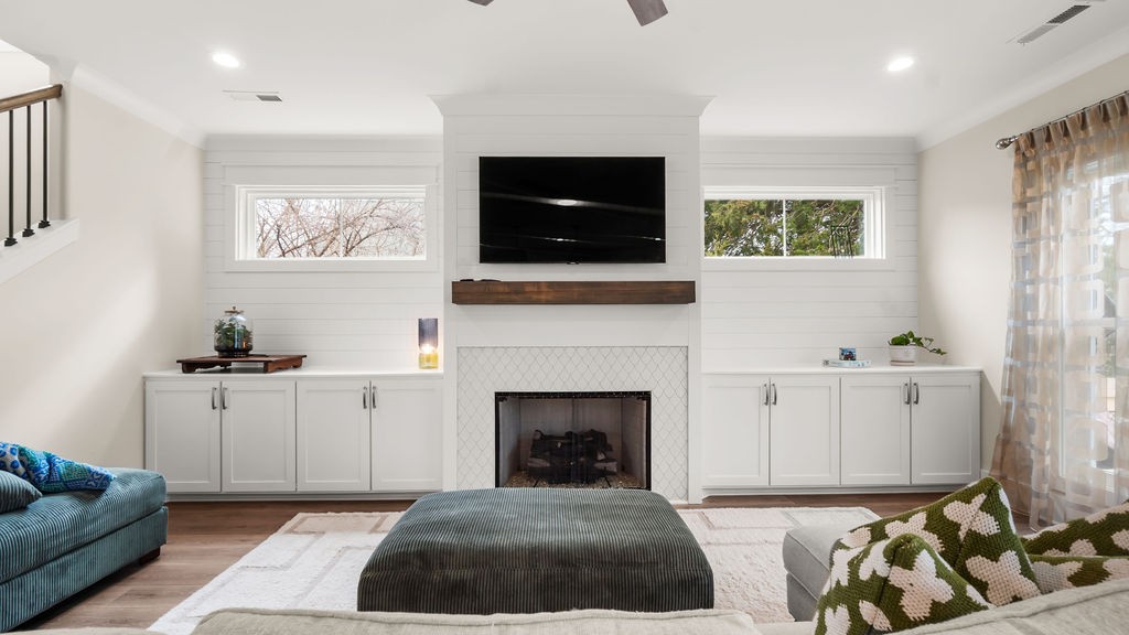 819 North Maple Street Murfreesboro, TN 37130 - Photo 12 of 64 a living room with furniture a flat screen tv and a fireplace