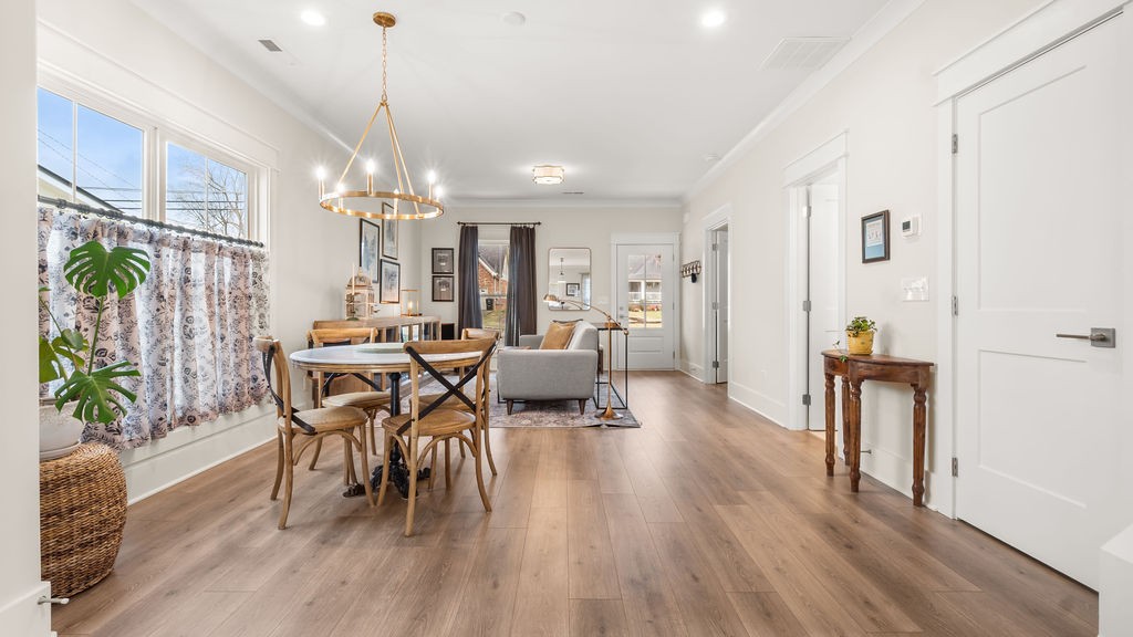 819 North Maple Street Murfreesboro, TN 37130 - Photo 16 of 64 a dining room with furniture a chandelier and wooden floor