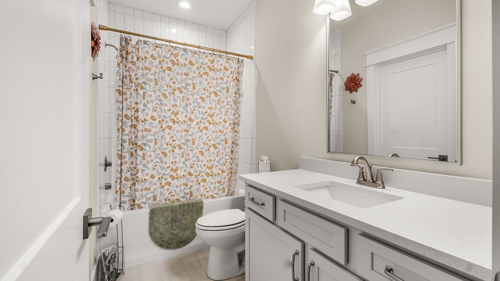 819 North Maple Street Murfreesboro, TN 37130 - Photo 23 of 64 a bathroom with a sink a toilet and shower curtain