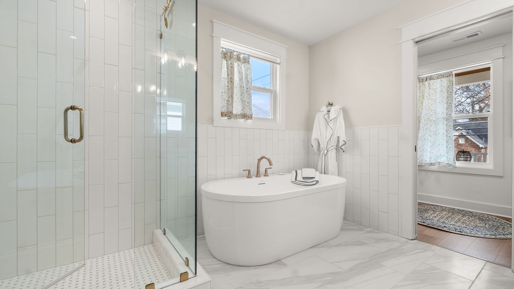 819 North Maple Street Murfreesboro, TN 37130 - Photo 32 of 64 a bathroom with a sink a mirror and shower