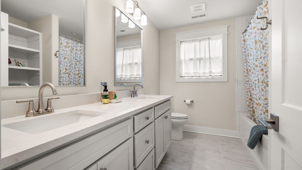 819 North Maple Street Murfreesboro, TN 37130 - Photo 40 of 64 a bathroom with a sink a toilet and a window