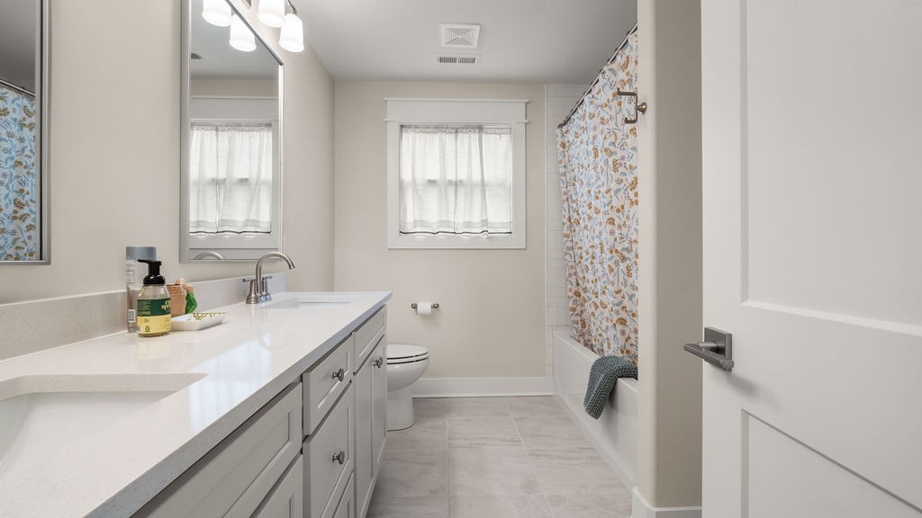 819 North Maple Street Murfreesboro, TN 37130 - Photo 41 of 64 a bathroom with a sink a toilet and a window