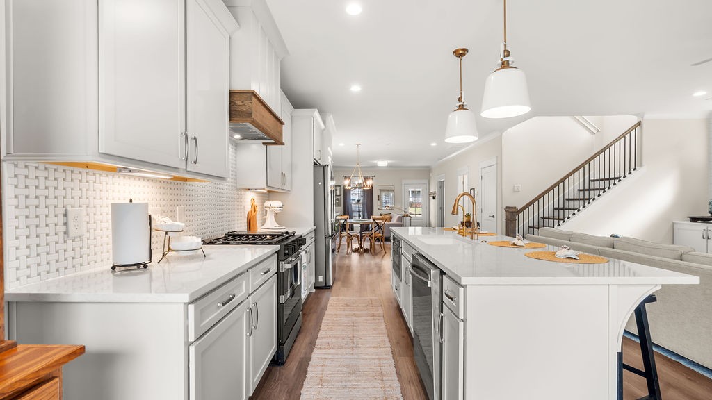 819 North Maple Street Murfreesboro, TN 37130 - Photo 6 of 64 a kitchen with stainless steel appliances granite countertop a sink a stove and a wooden floors