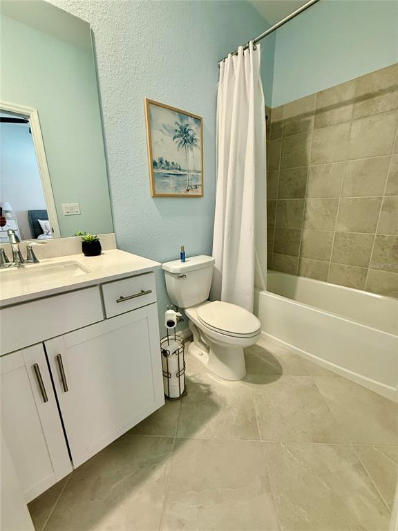 10852 Sun Drop Street Venice, FL 34293 - Photo 11 of 15 a bathroom with a sink toilet and shower