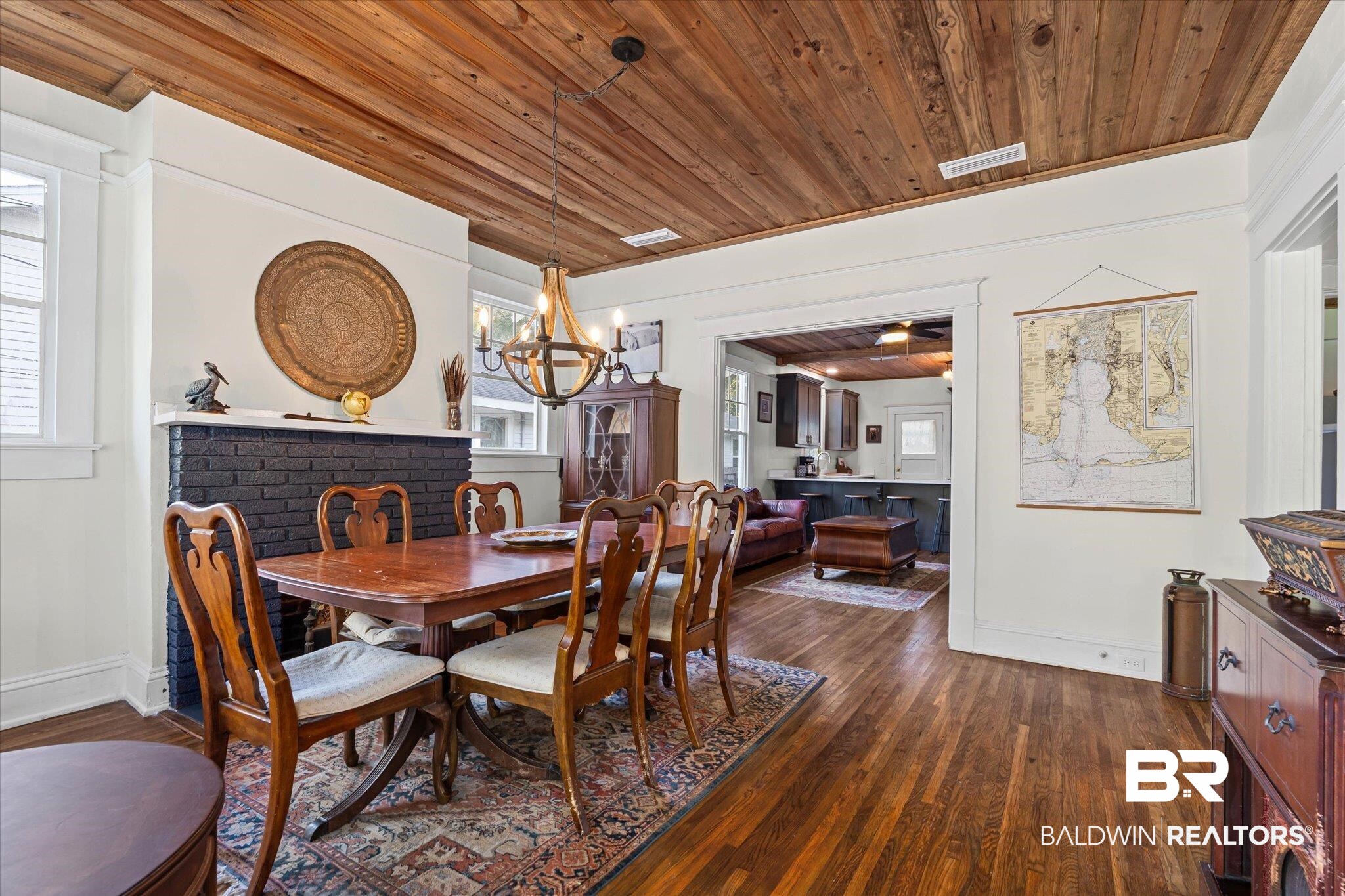 11 South Lafayette Street Mobile, AL 36604 - Photo 3 of 20 Dining space with dark wood-style floors, wooden ceiling, and a chandelier