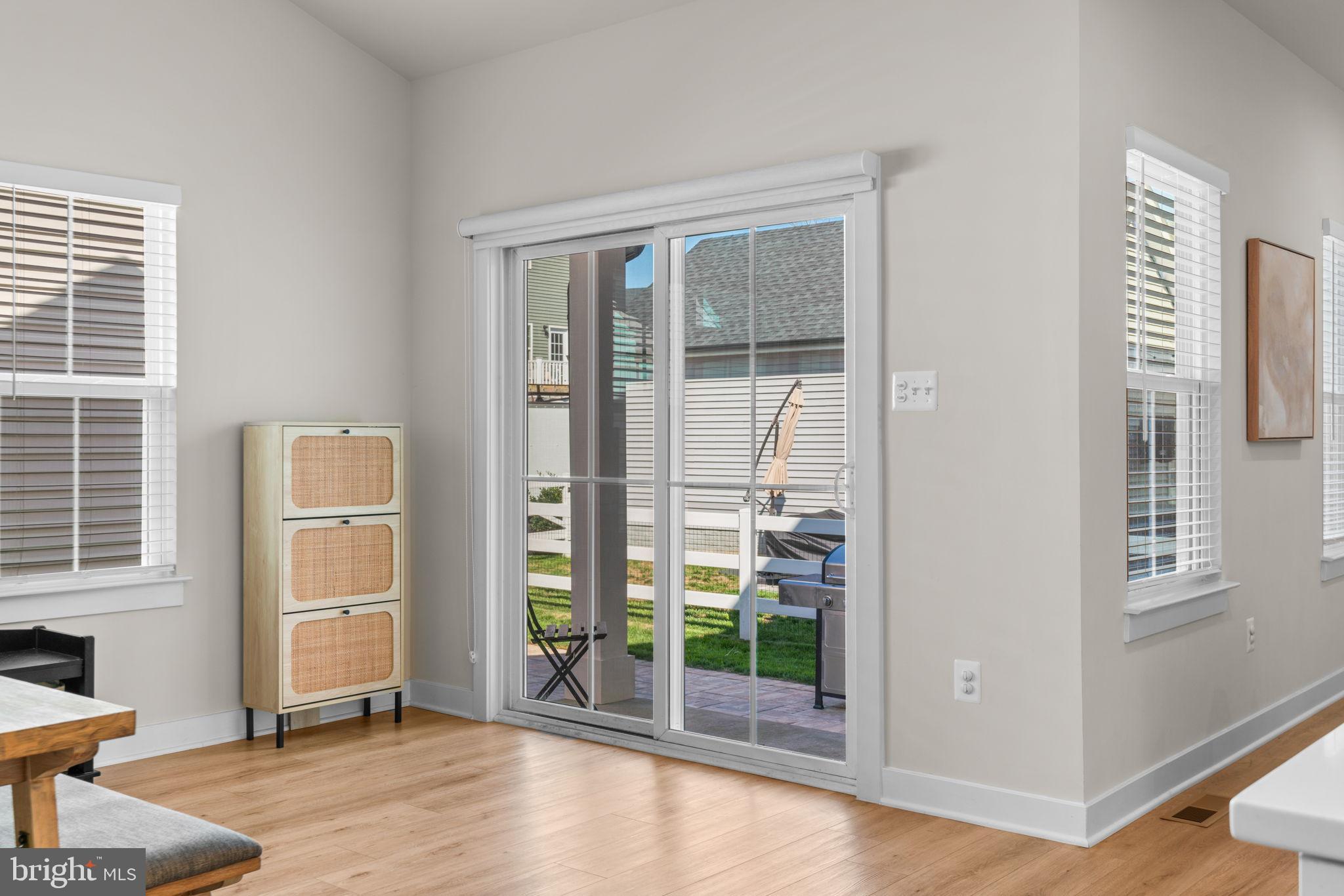 203 Baughmans Lane Frederick, MD 21702 - Photo 18 of 56 Bright and airy indoor-outdoor living space.