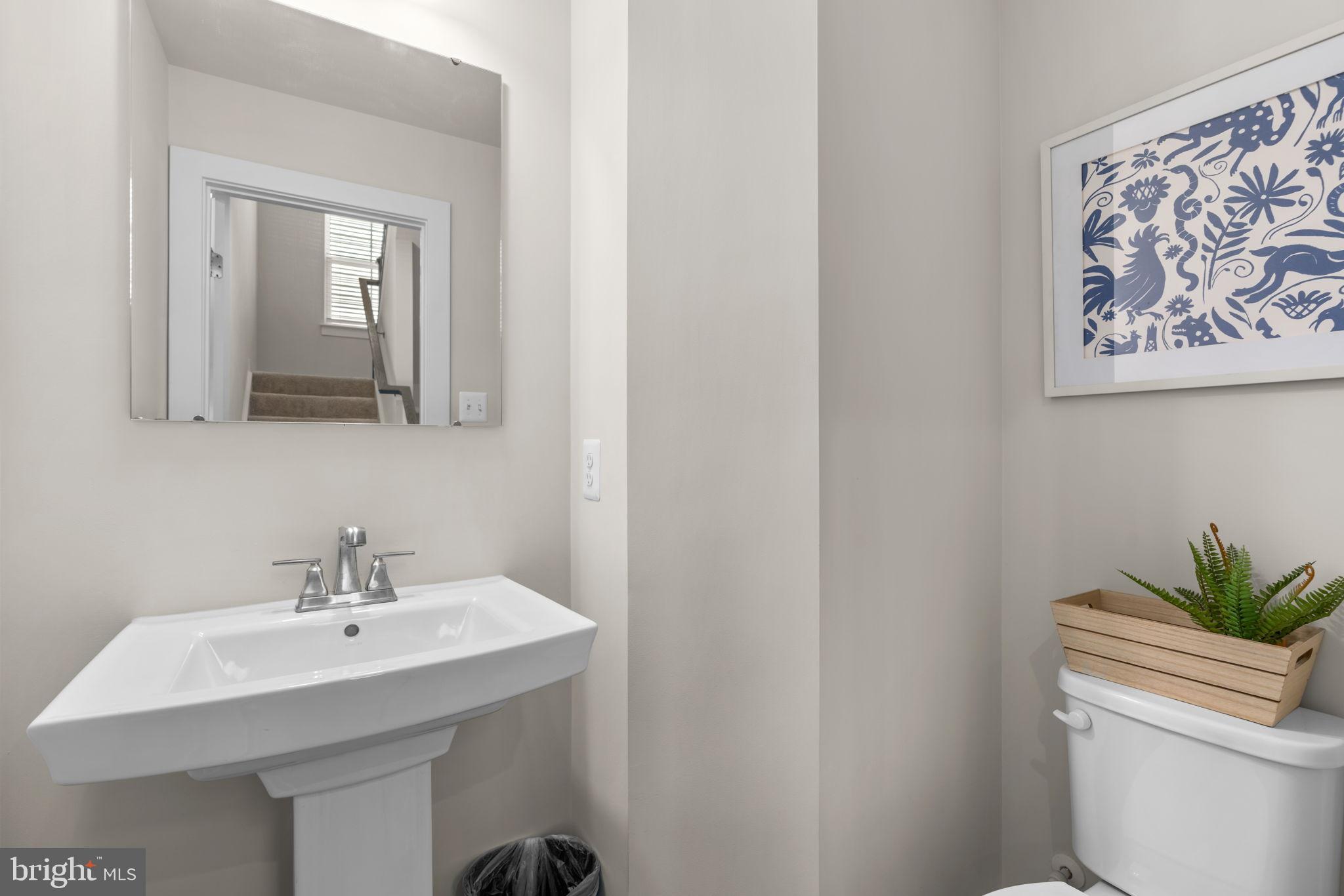 203 Baughmans Lane Frederick, MD 21702 - Photo 24 of 56 Sleek and modern half-bath retreat.