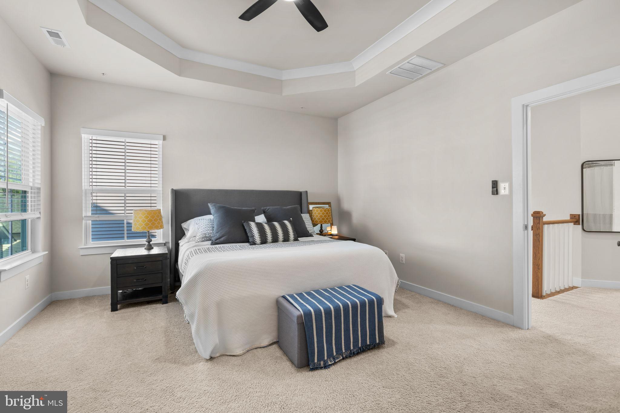 203 Baughmans Lane Frederick, MD 21702 - Photo 29 of 56 Serene bedroom with elegant design elements.