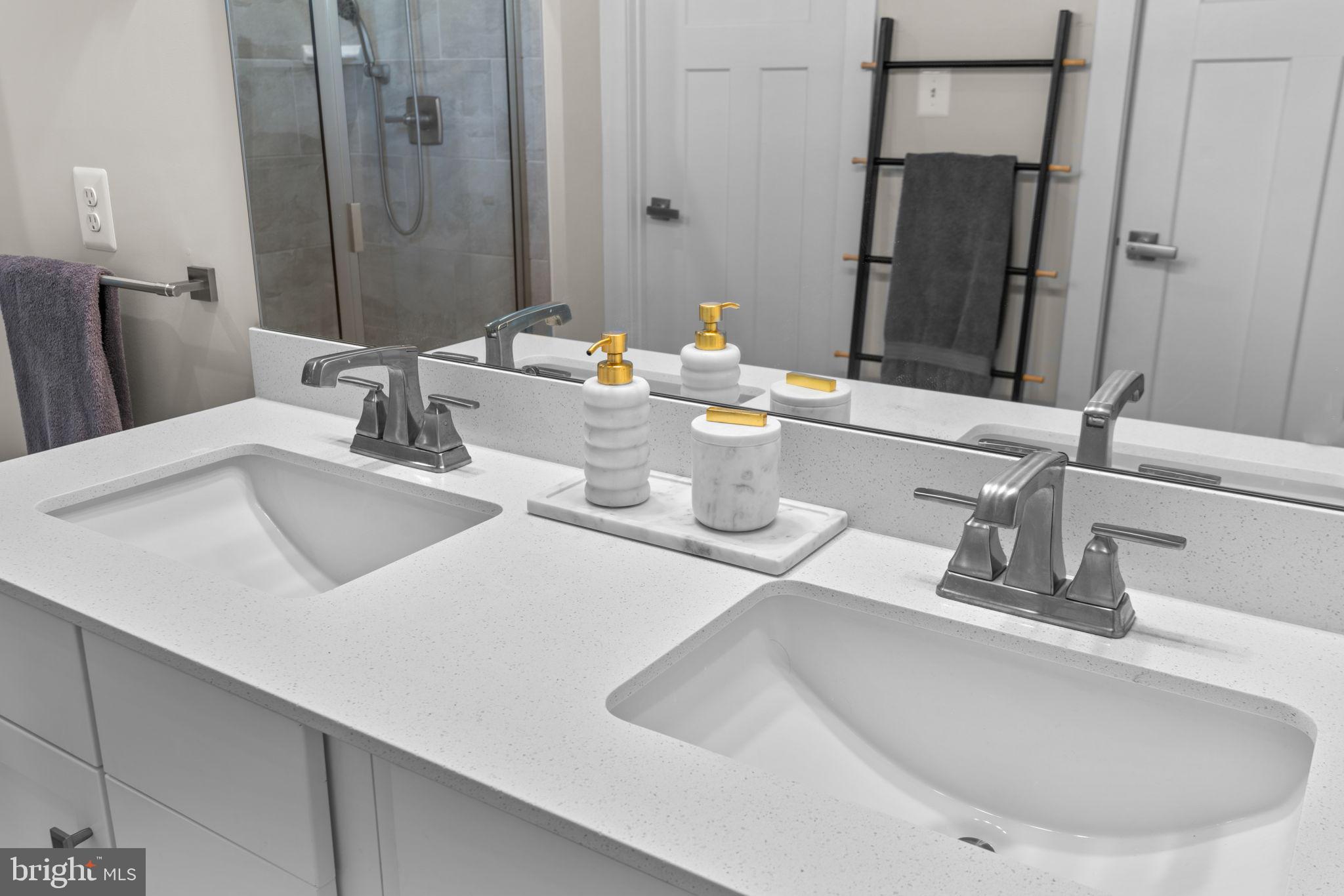 203 Baughmans Lane Frederick, MD 21702 - Photo 33 of 56 Sleek dual sink vanity in modern bathroom.