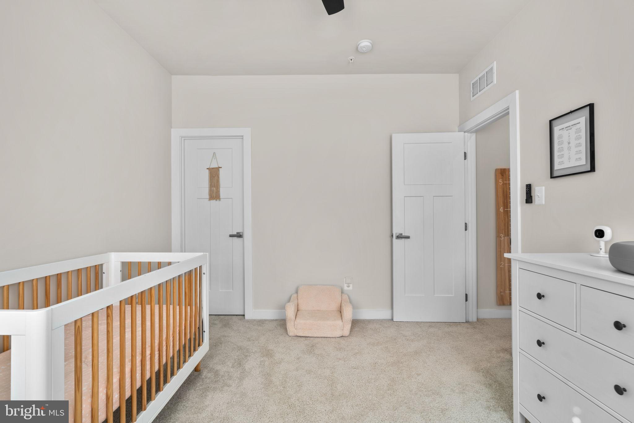 203 Baughmans Lane Frederick, MD 21702 - Photo 41 of 56 Serene nursery with soft, neutral tones.