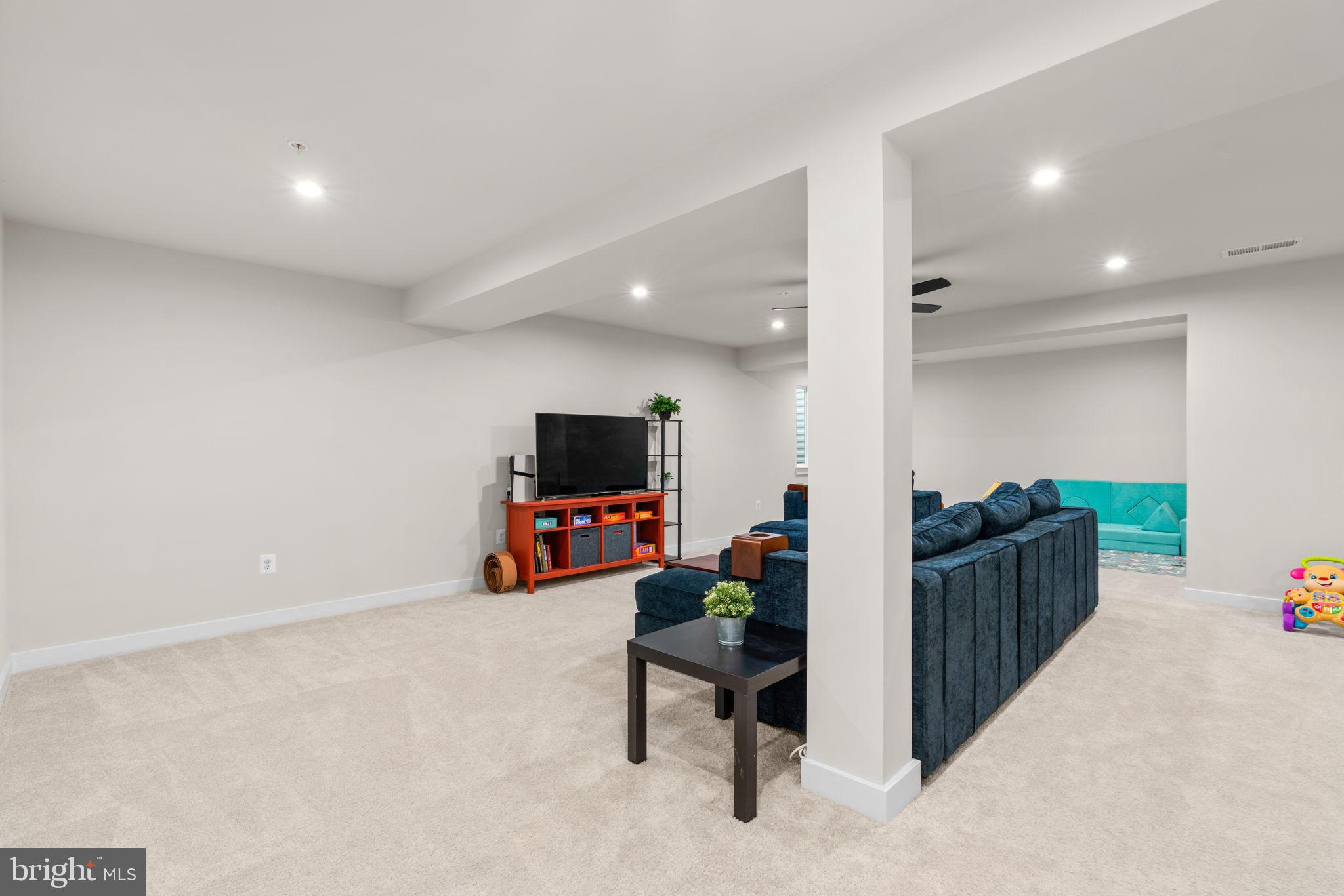 203 Baughmans Lane Frederick, MD 21702 - Photo 42 of 56 Spacious, modern living area with bright accents.