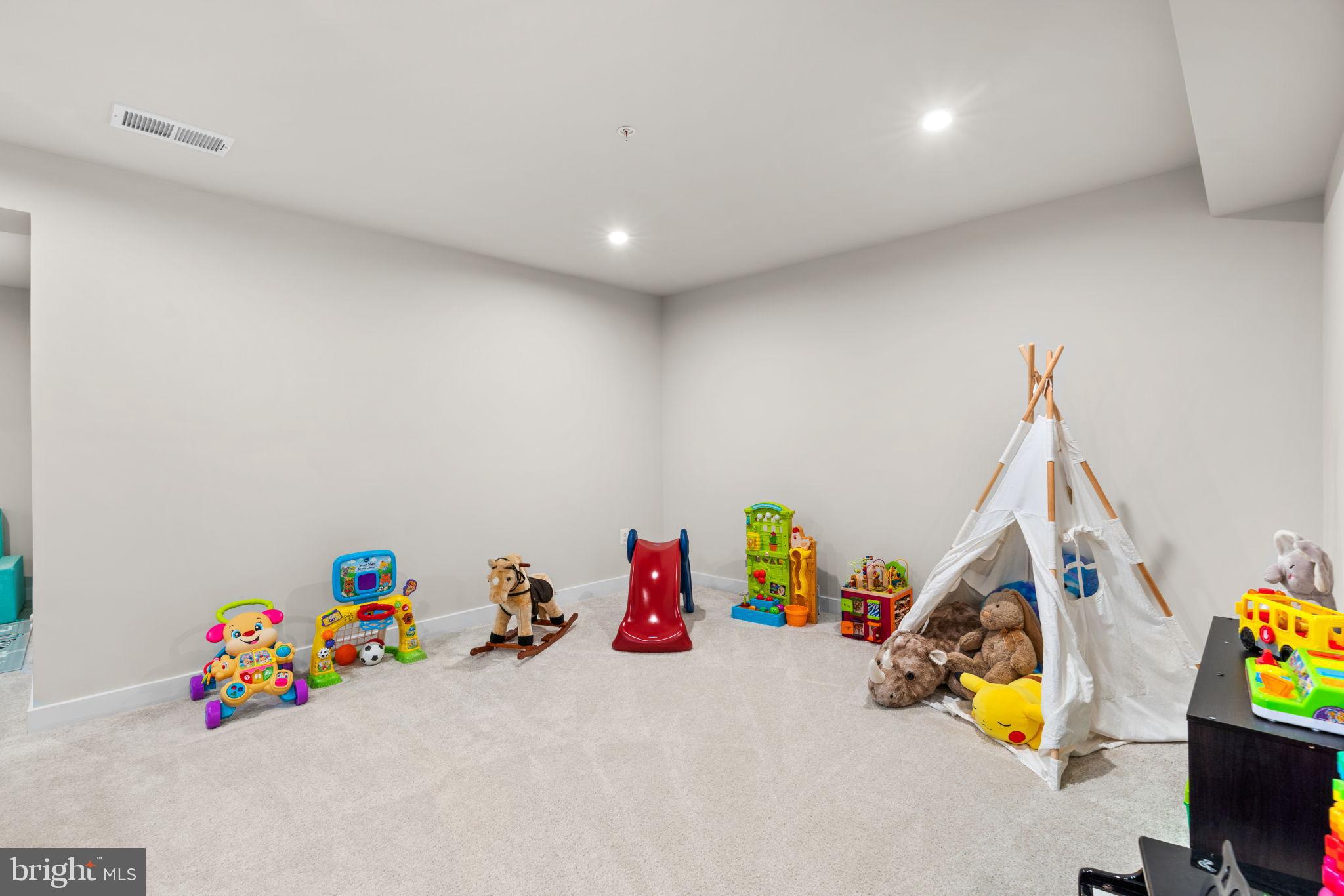 203 Baughmans Lane Frederick, MD 21702 - Photo 46 of 56 Bright and playful children's playroom space.