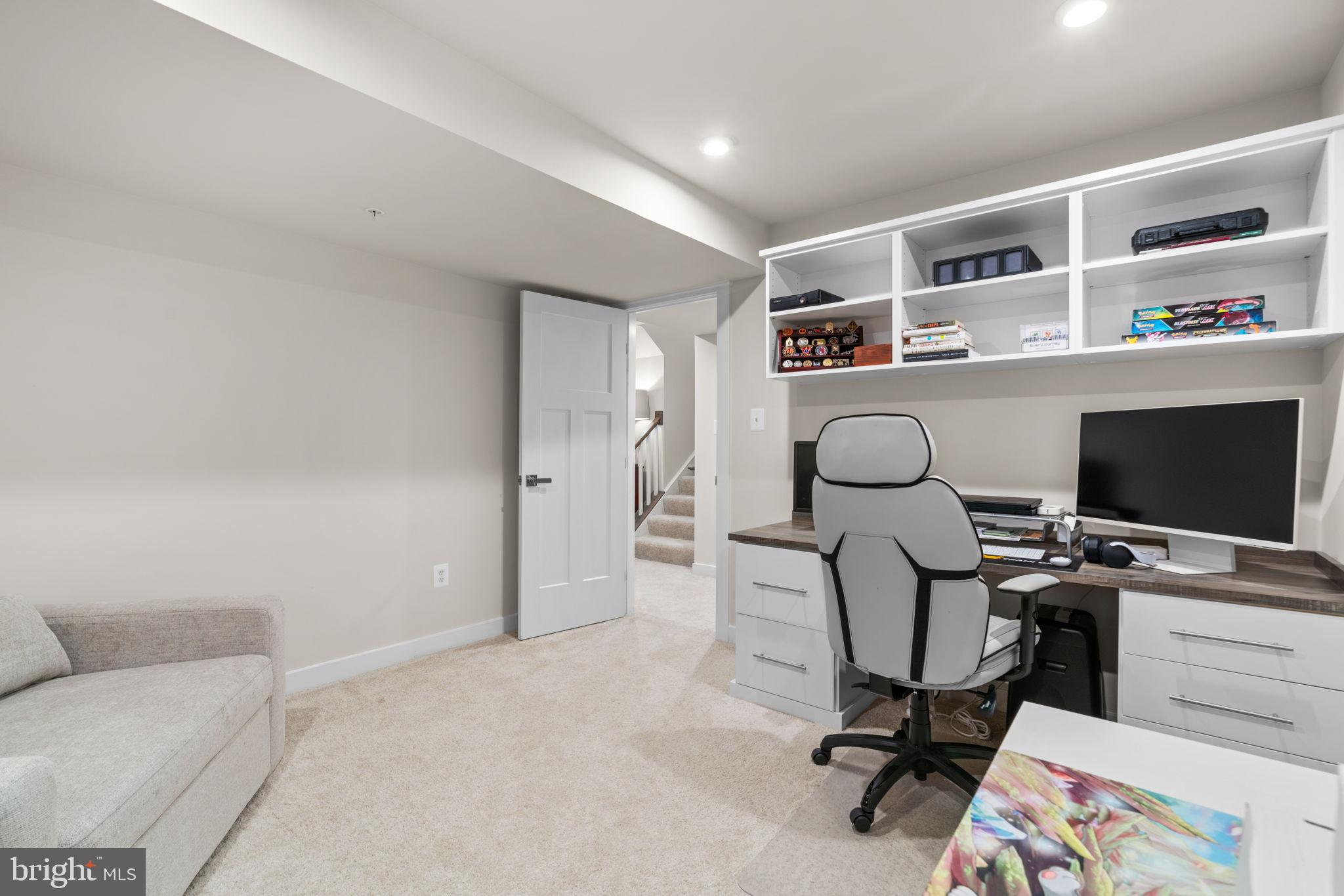 203 Baughmans Lane Frederick, MD 21702 - Photo 48 of 56 Modern workspace in a serene basement retreat.