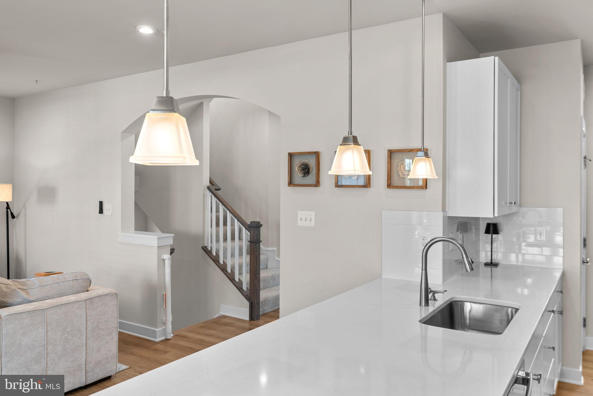 203 Baughmans Lane Frederick, MD 21702 - Photo 10 of 56 Modern kitchen with stylish lighting.