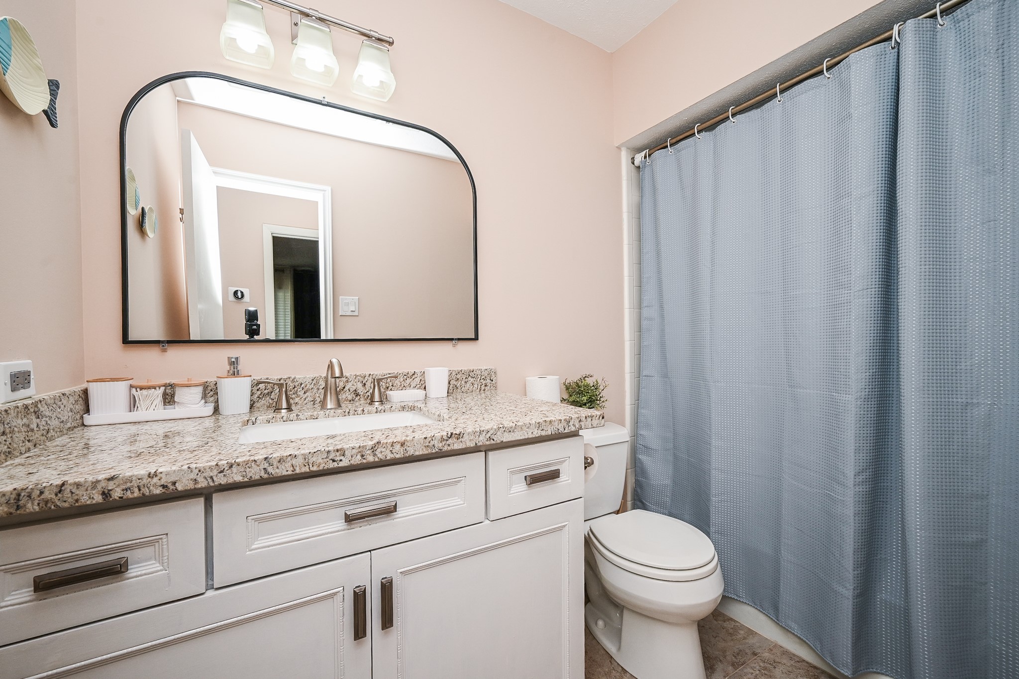19414 Dianeshire Drive Spring, TX 77388 - Photo 29 of 30 a bathroom with a granite countertop toilet sink and mirror