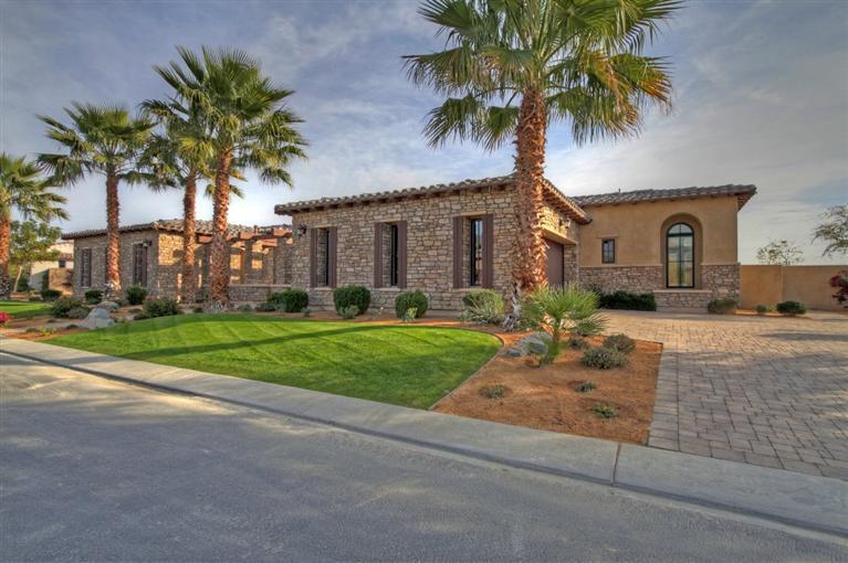 54540 Alysheba Drive La Quinta, CA 92253 - Photo 2 of 4 a front view of house with yard and green space