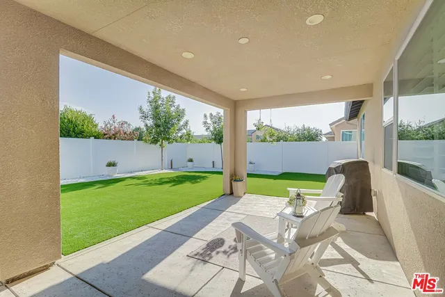 a view of backyard with furniture and garden