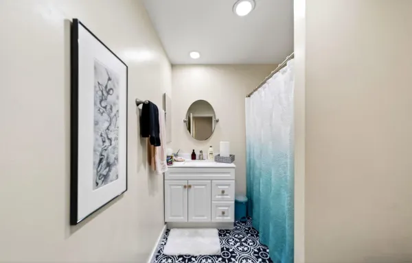a bathroom with a sink and a mirror