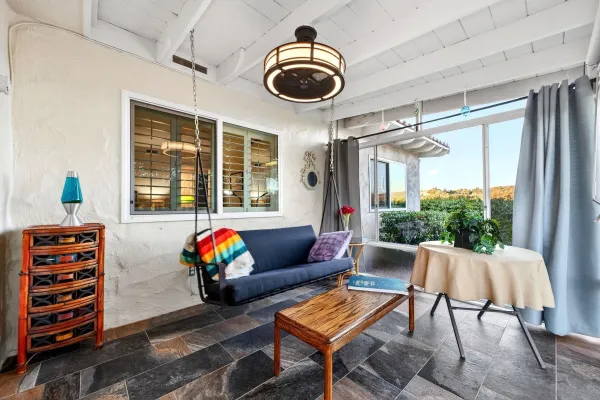 a living room with furniture and a window