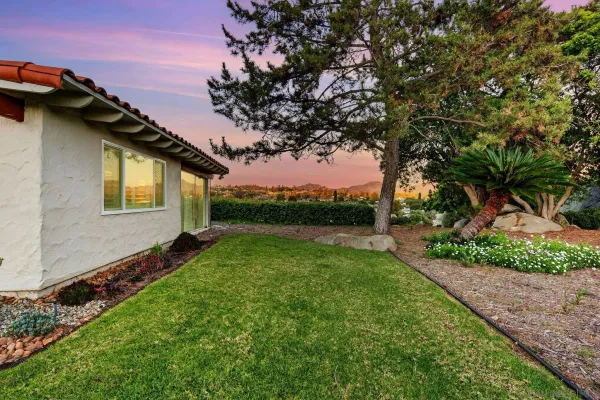 a backyard of a house with lots of green space