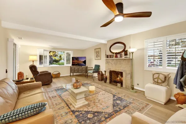 a living room with furniture and a fireplace