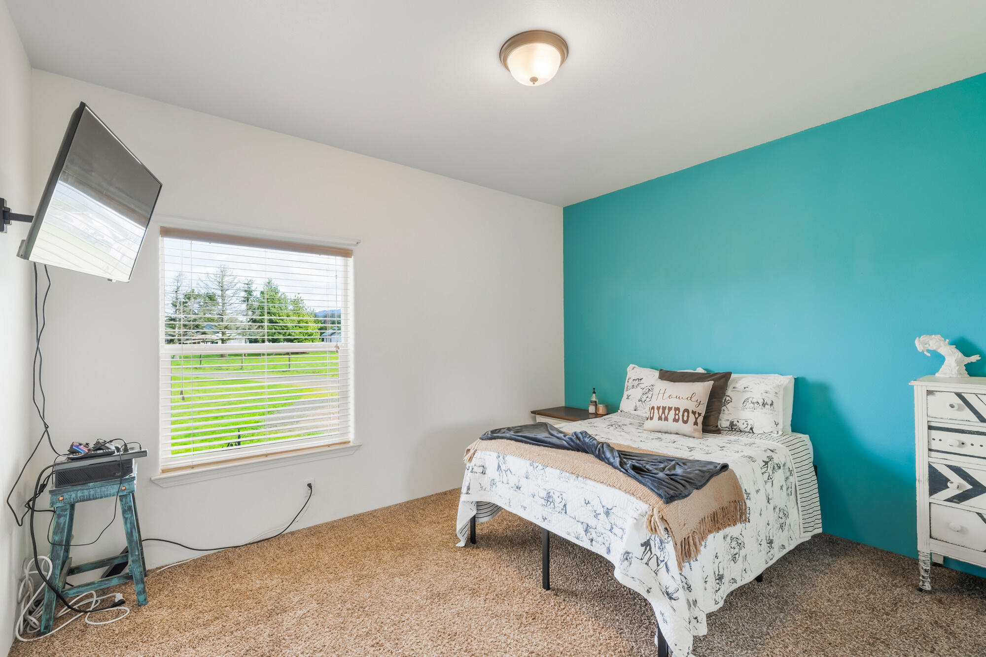 7400 South Prairie Road Tillamook, OR 97141 - Photo 51 of 62 a bedroom with a bed and a window