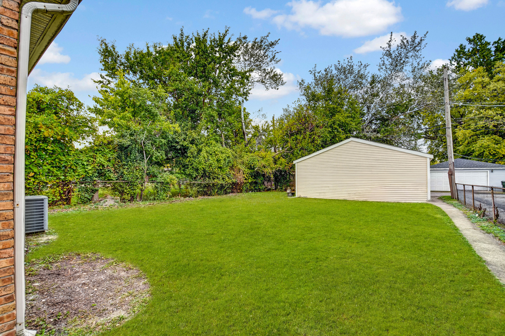 2950 Bernice Road Lansing, IL 60438 - Photo 16 of 16 a view of a backyard with a garden and entertaining space