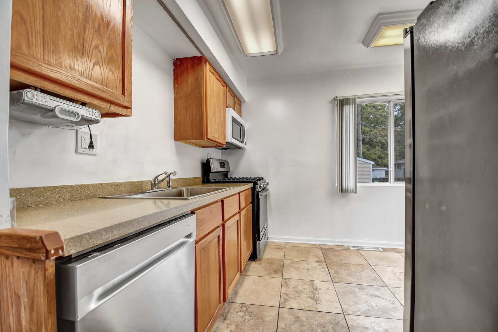 2950 Bernice Road Lansing, IL 60438 - Photo 5 of 16 a utility room with cabinets washer and dryer