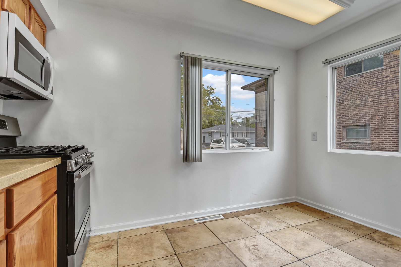 2950 Bernice Road Lansing, IL 60438 - Photo 6 of 16 a view of an empty room with a window