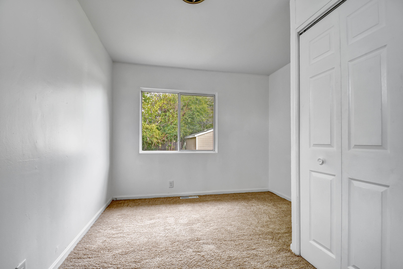 2950 Bernice Road Lansing, IL 60438 - Photo 8 of 16 an empty room with a window