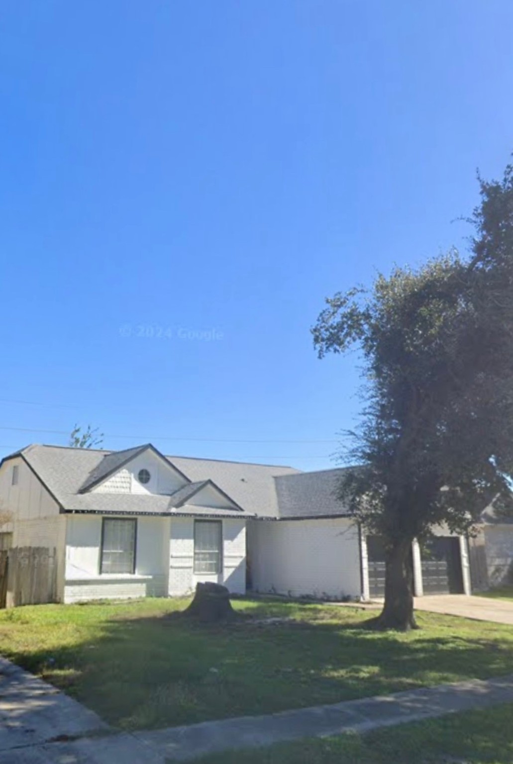 22814 Pebworth Place Spring, TX 77373 - Photo 1 of 3 Charming single-story home with a gabled roof, featuring a spacious front yard with a mature tree. The exterior is light-colored with dark trim, and there's a driveway leading to a two-car garage. Great curb appeal in a quiet neighborhood.