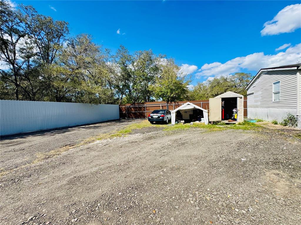 18304 Cedarhurst Road Orlando, FL 32820 - Photo 17 of 24 a front view of a house with a yard