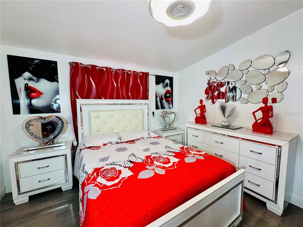 18304 Cedarhurst Road Orlando, FL 32820 - Photo 2 of 24 a bedroom with a bed and closet