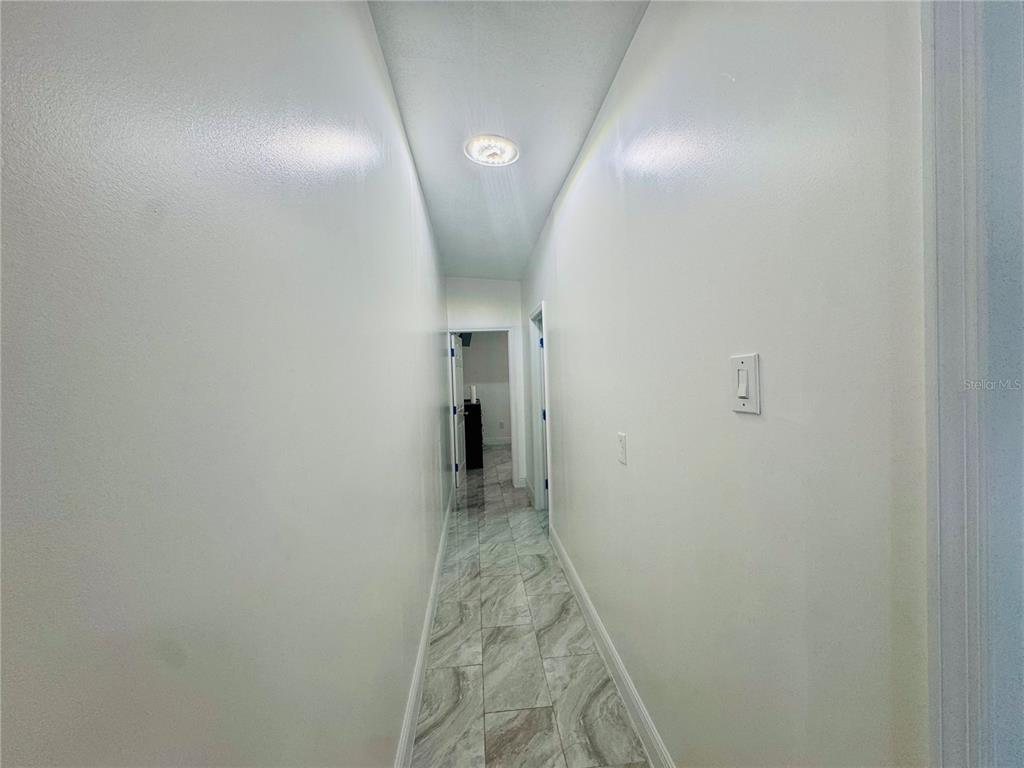 18304 Cedarhurst Road Orlando, FL 32820 - Photo 22 of 24 a view of a hallway