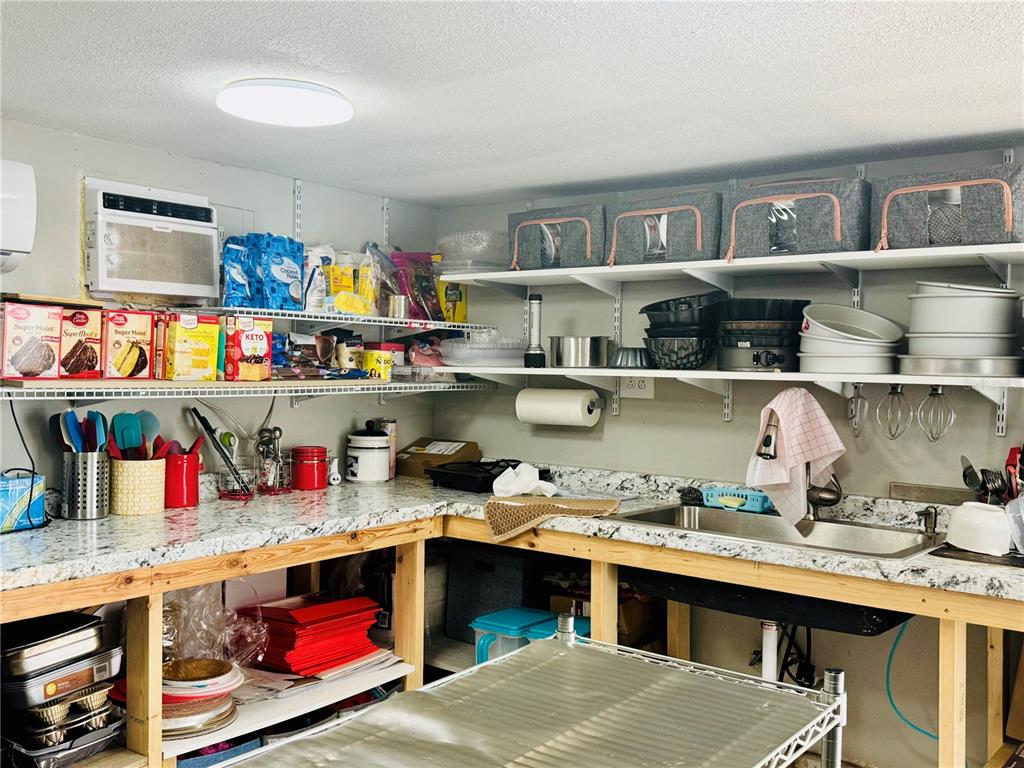 18304 Cedarhurst Road Orlando, FL 32820 - Photo 23 of 24 a room with storage and utility