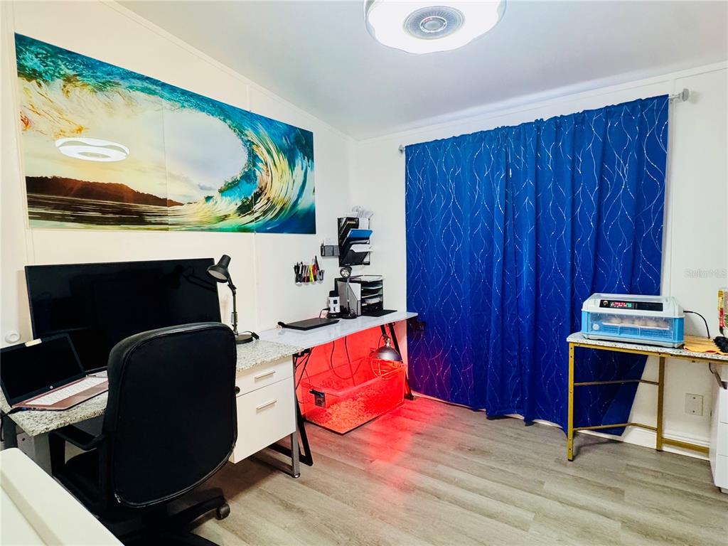 18304 Cedarhurst Road Orlando, FL 32820 - Photo 10 of 24 a living room with furniture piano and wooden floor