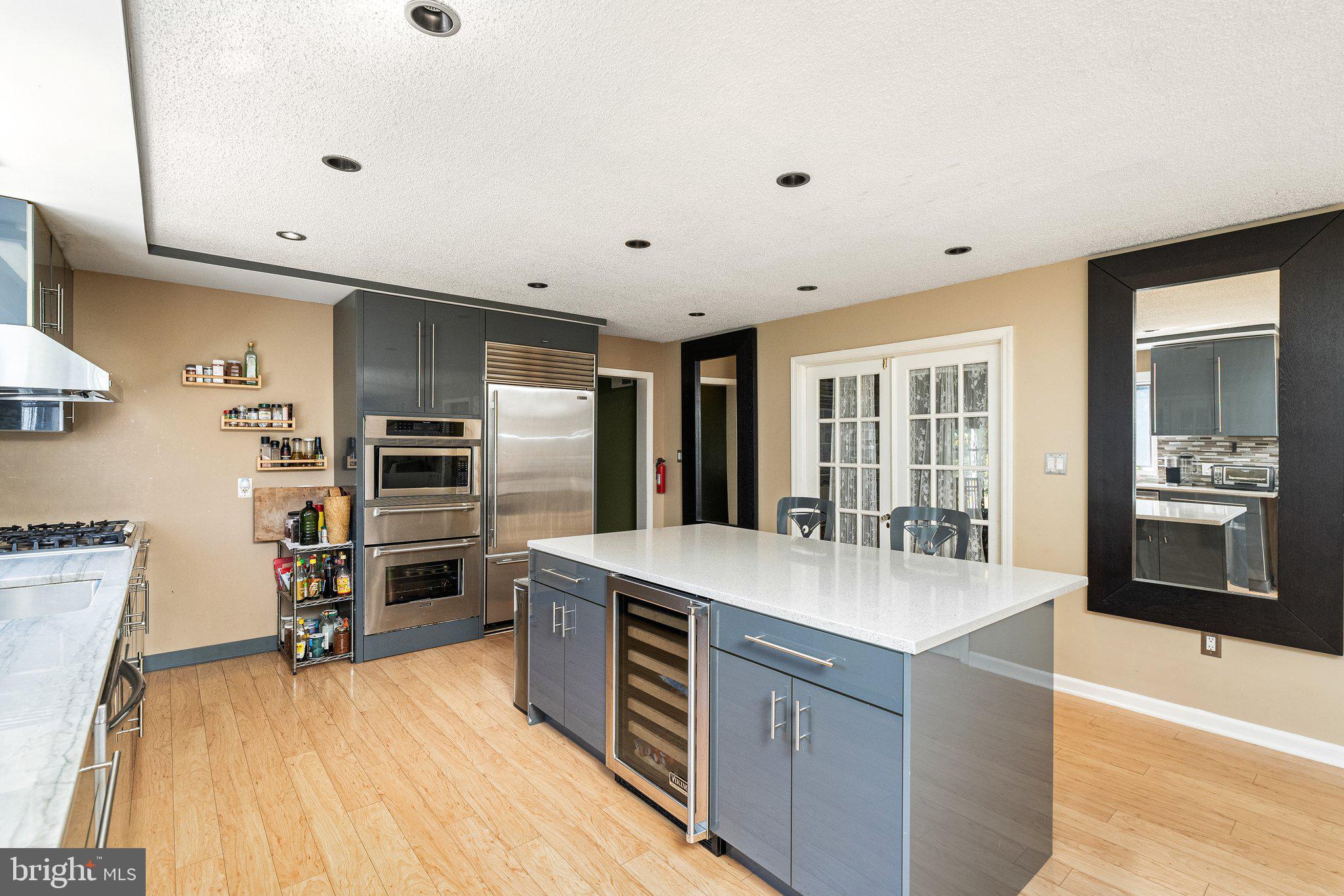 87 Bordentown Chesterfield Road Chesterfield, NJ 08515 - Photo 12 of 49 a large kitchen with stainless steel appliances a large counter top and a stove