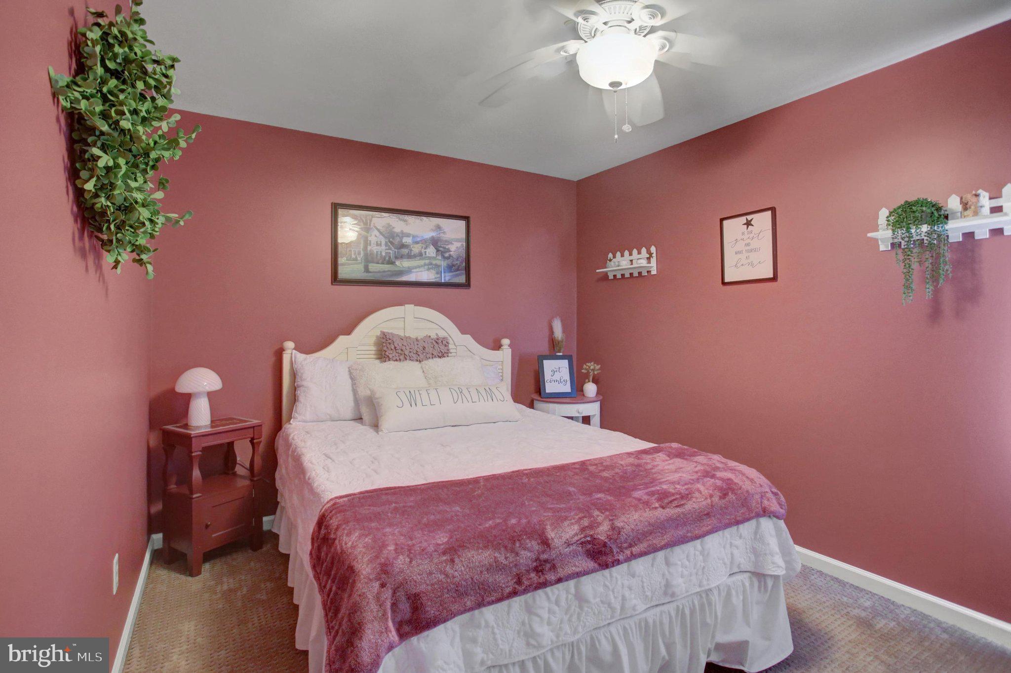 11086 Welsh Run Road Greencastle, PA 17225 - Photo 36 of 63 a bedroom with a bed and a chandelier