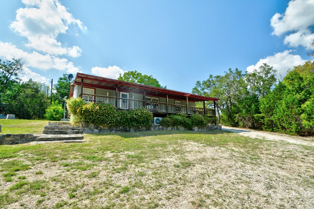 3761 Junction Highway Ingram, TX 78025 - Photo 1 of 1 a front view of a house with garden