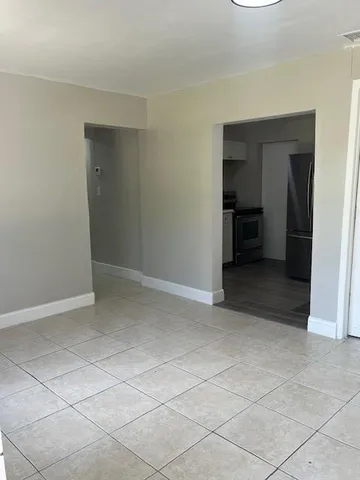 an empty room with a bathroom