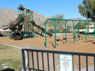 a view of swimming pool from a bathroom