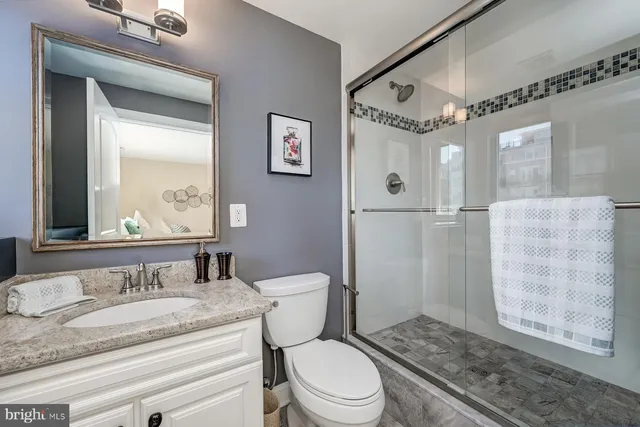 a view of a a dining room with furniture window and wooden floor