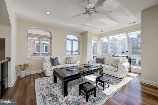 a view of a dining room with furniture and a chandelier