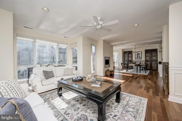 a large kitchen with granite countertop a large counter top stainless steel appliances and cabinets