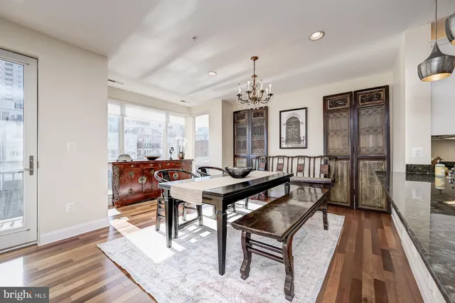 a large kitchen with stainless steel appliances granite countertop a stove and cabinets
