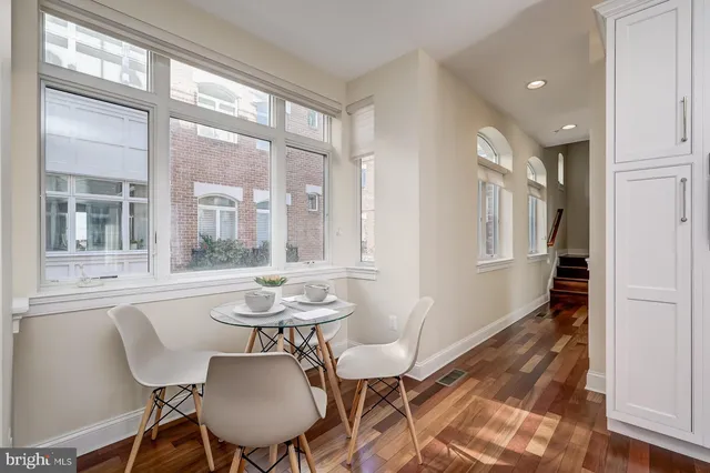 a spacious bedroom with a bed and a flat screen tv