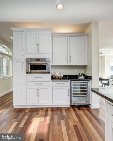 a living room with couches chairs and a coffee table