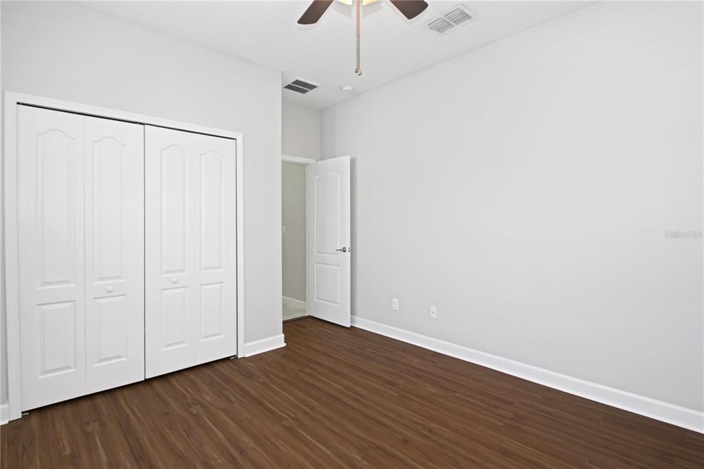 2069 Nerva Road Winter Garden, FL 34787 - Photo 13 of 41 a view of an empty room with wooden floor
